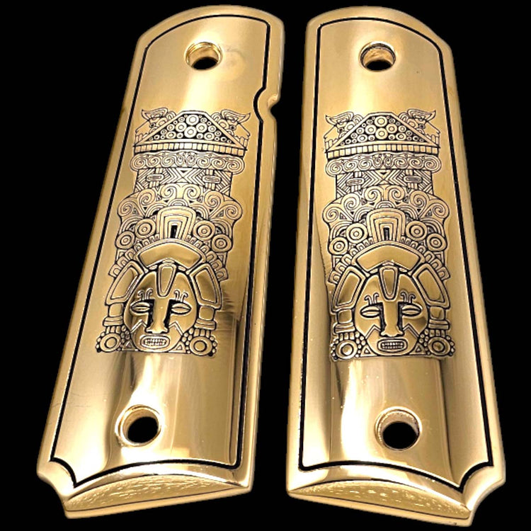 Custom aluminum 1911 grips polished to a mirror finish with intricate Aztec design

