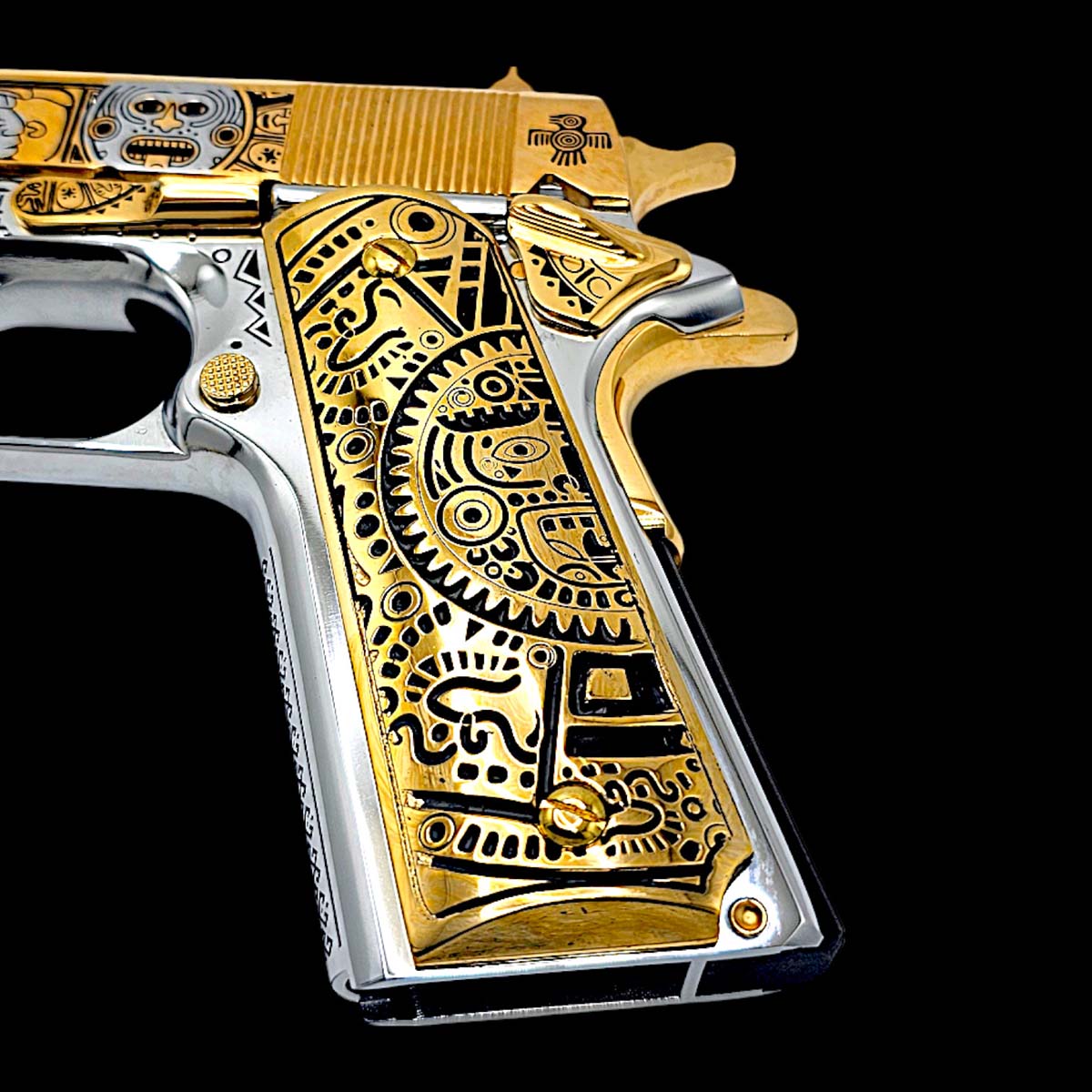 "Pair of 1911 grips in mirror-polished 24K gold with Mayan Calendar artwork."

