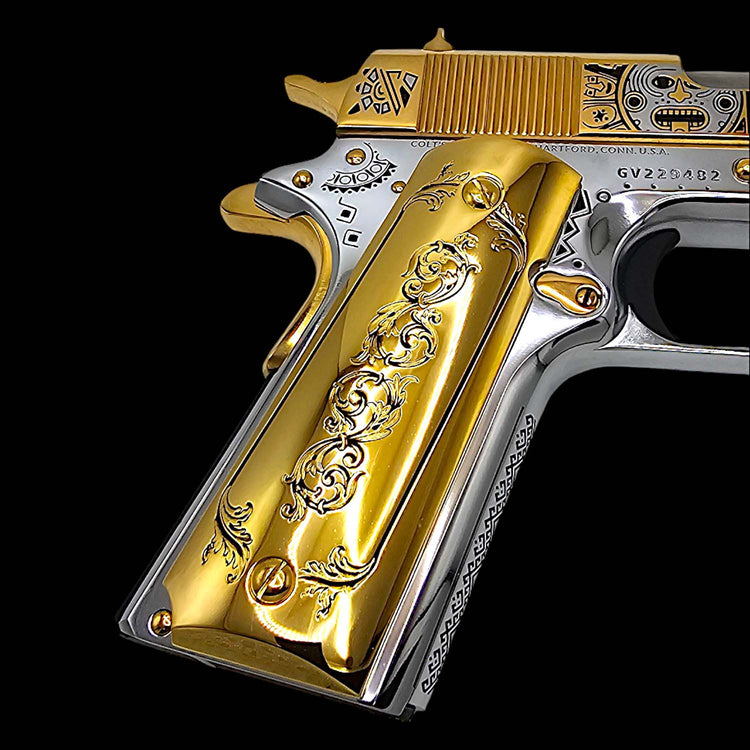 Close-up of engraved filigree scroll on gold plated 1911 pistol grip

