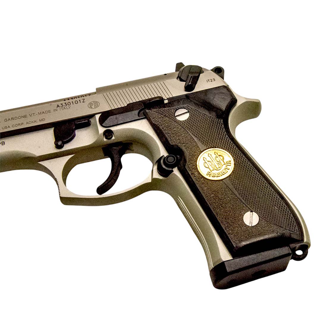 Close-up of Beretta medallion in ebony pistol grip
