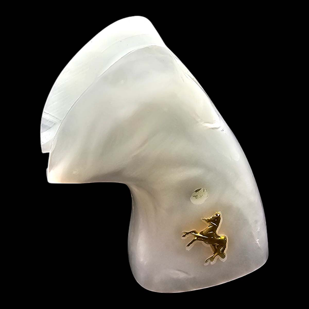 Close-up of 24K gold-plated Colt horse medallion on white pearl polymer revolver grip